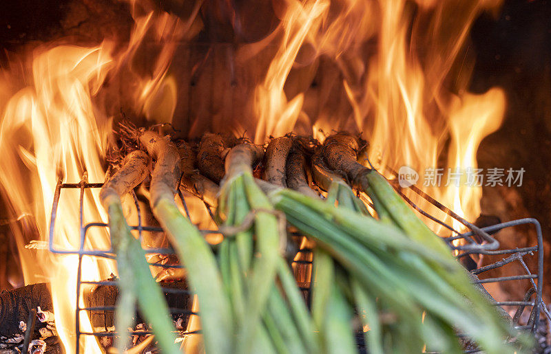 long onions being roasted in chimney,  Catalonian tradition - Calçots